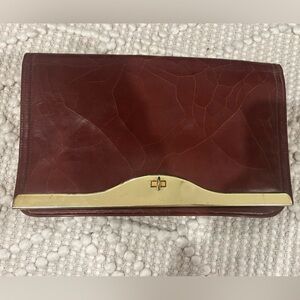Vintage oxblood Clutch or purse with Gold Accent leather 1970s